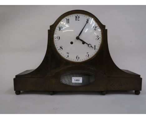 Early to mid 20th Century mantel clock of Art Deco design, the beaten metal case enclosing a circular enamel dial, with Arabi