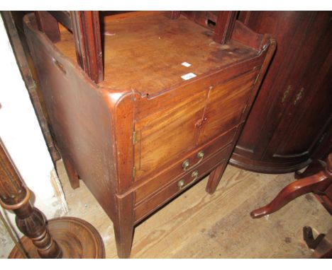19th Century mahogany tray top commode, having galleried top with two flush panelled doors, above dummy drawer sliding front 