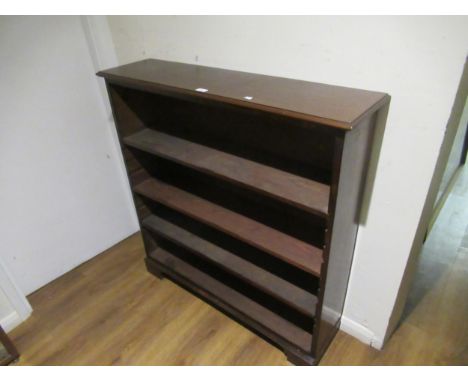19th Century mahogany open bookcase, the moulded top above adjustable shelves, on bracket feet, 42ins x 11ins x 43ins high 