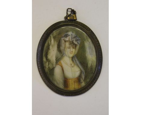 19th Century oval watercolour, portrait miniature of a lady, in a brass frame (at fault) 