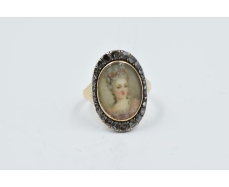 19th Century French 18ct gold ring set with a miniature portrait of a lady, surrounded by rose cut diamondsThe glass covering