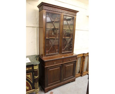 Pair of early 20th Century mahogany bookcases, each with a moulded and blind fretwork cornice above a pair of astragal glazed