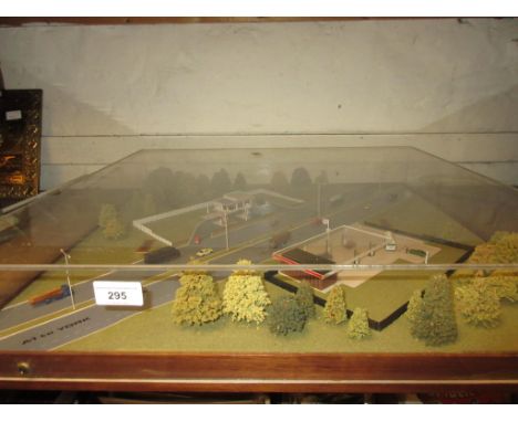 Mid 20th Century architect scale model of Esso petrol stations on the A1, housed in a square perspex case 