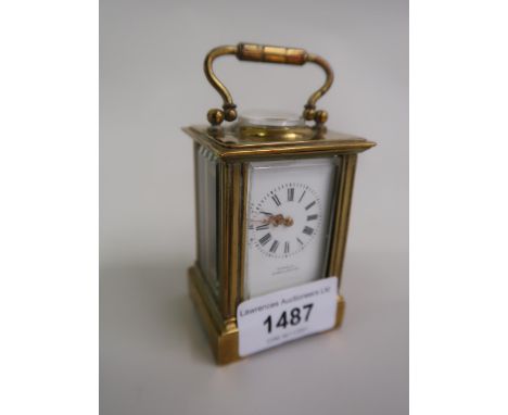 Miniature early 20th Century brass cased carriage clock, the enamel dial with Roman numerals, signed Tanner, Cirencester, wit