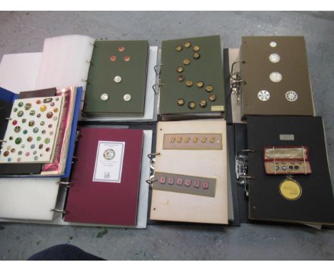 An extensive button collection presented in thirteen ring binders, including examples in Satsuma, mother of pearl, glass, met