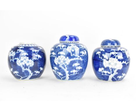 Three Chinese late Qing dynasty blue and white ginger jars, late 19th/early 20th century, each in the Kangxi style in the pru