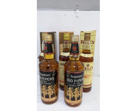 Three boxed bottles of Bells Old Scotch Whisky, 2 x 70cl, 1 x 75cl and two bottles of Seagram's 100 Pipers de luxe Scotch Whi