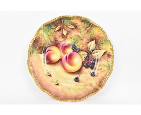 A Royal Worcester fruit decorated cabinet plate, of shaped circular form, hand painted with still lives of fruit and signed T