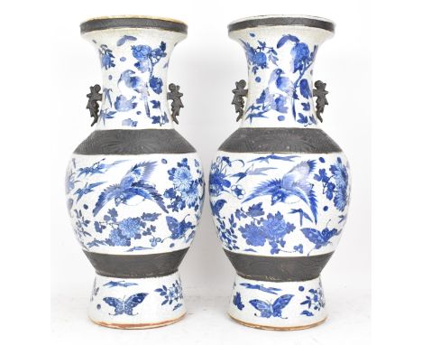 A pair of Chinese late Qing dynasty nanking crackle glazed blue and white vases, late 19th century, each decorated with birds