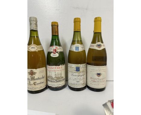 Four bottles of white wine to include Puligny Montradet 1992, Sancerre 19987, Bourgogne 1985, Montagny 2002, Location: R2If t