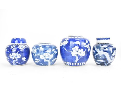 Four Chinese late Qing dynasty blue and white ginger jars, late 19th/early 20th century, each in the Kangxi style, the larges