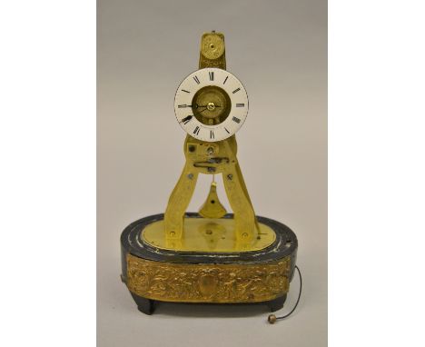 Small 19th Century French brass skeleton clock, the circular enamel dial with Roman numerals, signed Kilpatrick and Co. Paris