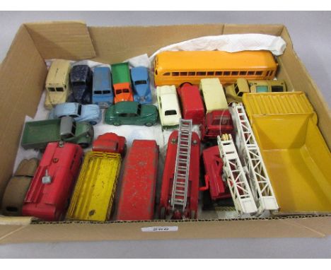 Collection of twenty unboxed Dinky die-cast metal model vehicles including Wayne Bus, Guy Slumberland lorry and a fire engine