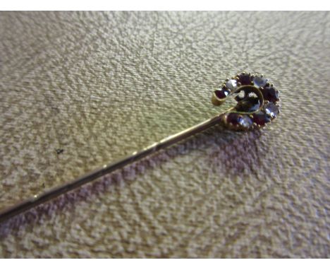 Late 19th or early 20th Century rose cut diamond and pink ruby set horseshoe design stick pin