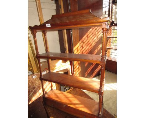 Late 20th Century mahogany three shelf wall bracket having carved and turned decoration with single long drawer and brass han