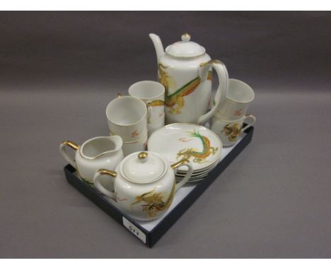 Japanese eggshell tea service decorated with dragons with portrait lithophanes to the cups