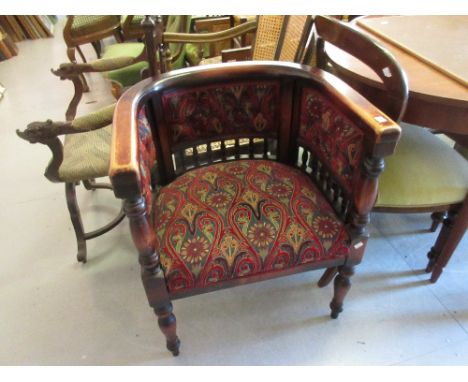 1920's Stained beechwood and button upholstered tub shaped chair raised on turned tapering front supports