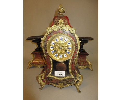 Small 19th Century French buhl mantel clock, the waisted case decorated with red stained tortoiseshell and cut brass inlays, 