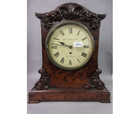 Early Victorian figured mahogany bracket clock, the case with applied, carved and floral decoration above a plinth, the paint