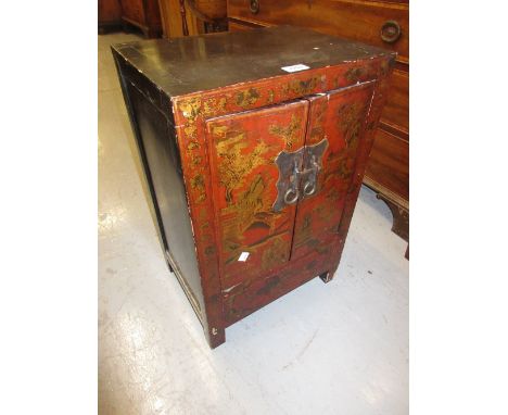 Small 20th Century Chinese red chinoiserie lacquer two door cabinet, 16ins wide