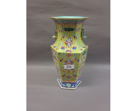 Early 20th Century Canton enamel baluster form hexagonal vase, having all-over floral decoration with character mark to front