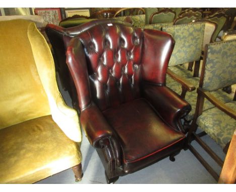 Pair of burgundy button leather upholstered wing armchairs with cabriole supports