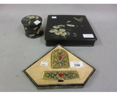 Two 19th Century papier mache floral decorated boxes together with a mid 20th Century paste decorated compact and comb in ori