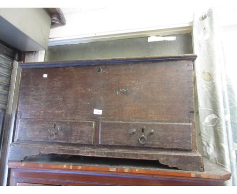18th Century oak trunk with a hinged lid above two drawers raised on bracket feet CONDITION REPORT 37ins wide x 22ins deep x 