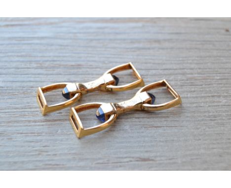 Cartier of Paris pair of gold stirrup cufflinks, each set with two sugar loaf sapphires with Paris hallmarks, circa 1950, hou