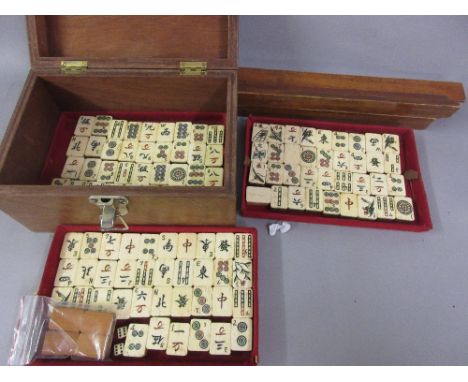 Chinese bone and bamboo mahjong set in a later made casket, retaining original trays (at fault), including counter holders CO