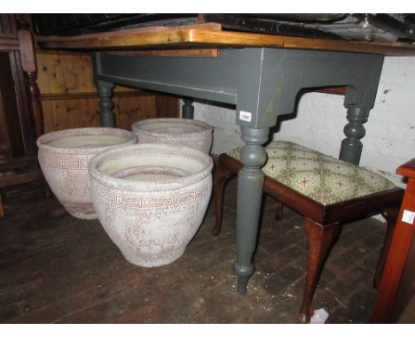 Rectangular oak kitchen table with a painted base together with a set of six similar stick back kitchen chairs