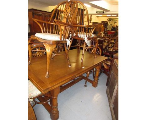 Good quality reproduction oak refectory style draw-leaf dining table on baluster turned supports with stretchers, together wi