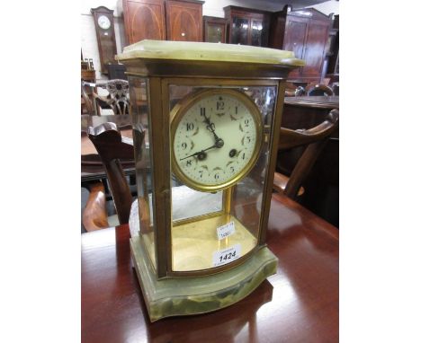 Late 19th or early 20th Century gilt brass and onyx library clock, the four glass case with bow front enclosing an enamel dia