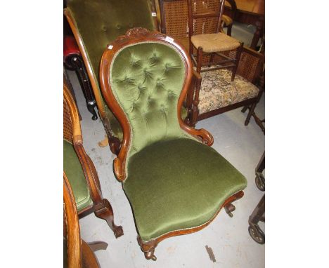 Victorian walnut and green button upholstered nursing chair raised on cabriole supports
