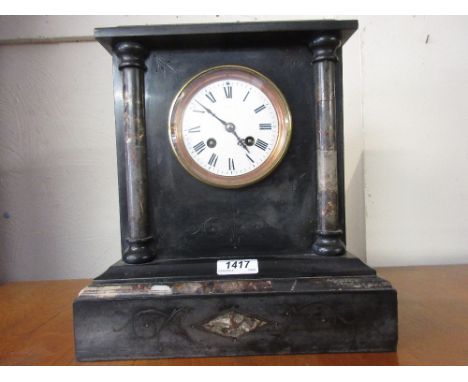 Victorian black slate and flecked marble mantel clock, the enamel dial with Roman numerals and a two train movement