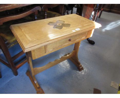 Small light oak and inlaid side table with a single frieze drawer, raised on shaped end supports