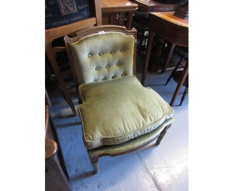 Small 19th Century French painted and parcel gilt nursing chair with green button upholstery raised on fluted supports
