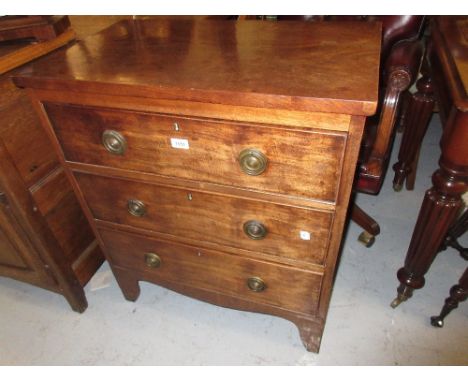 Small early 19th Century mahogany straight front chest of three drawers with brass ring handles raised on bracket feet
