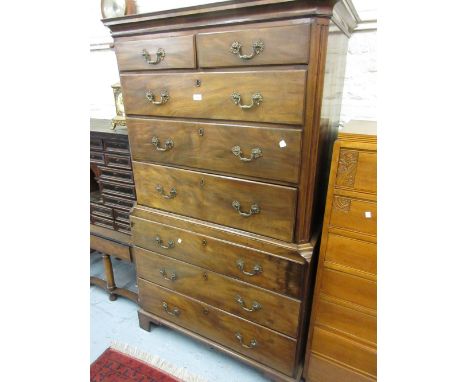 George III mahogany chest on chest, the moulded cornice above two short and six long graduated drawers with cast brass handle