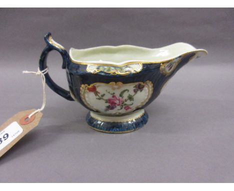 18th Century English sauce boat painted with panels of summer flowers on a blue scale ground (restored) CONDITION REPORT The 