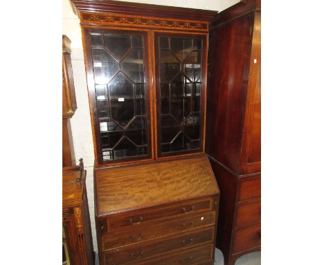 Edwardian mahogany and marquetry inlaid bureau bookcase with two astragal glazed doors above a fall front and drawers on brac