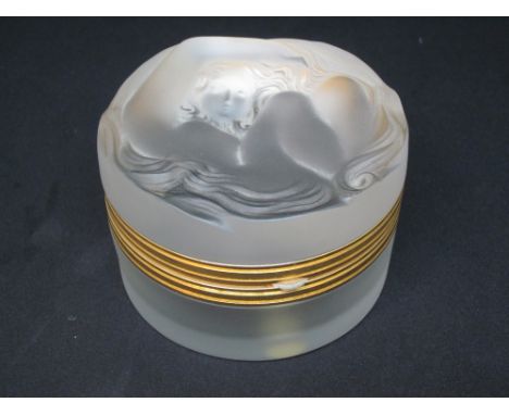 Modern Lalique powder box, the hinged frosted cover decorated in relief with a stylised female portrait, 7.5cms diameter in o