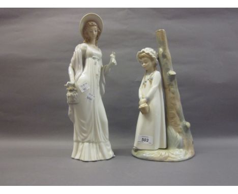 Lladro figure of a young lady holding a purse, 14ins high, together with a Nao lamp base of a young girl against a tree trunk