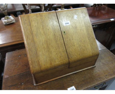 Victorian oak two door stationery box with sloping front, together with a sarcophagus shaped tea caddy