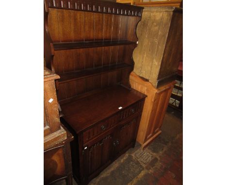 Reproduction oak dining room suite comprising: a draw-leaf refectory style table, set of four ladder back chairs and a dresse