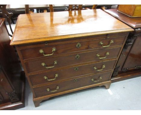 George III mahogany chest of four long graduated drawers having brass swan neck handles with brushing slide raised on bracket