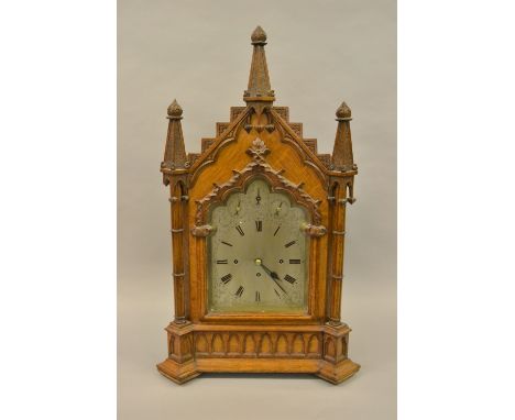 19th Century oak Gothic Revival bracket clock, the architectural case with spire surmounts above an arched door flanked by cl