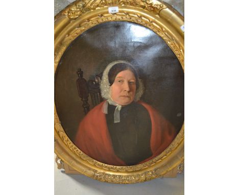 19th Century English school, oil on canvas, half length portrait of a lady wearing a lace bonnet and red shawl, in oval gilde
