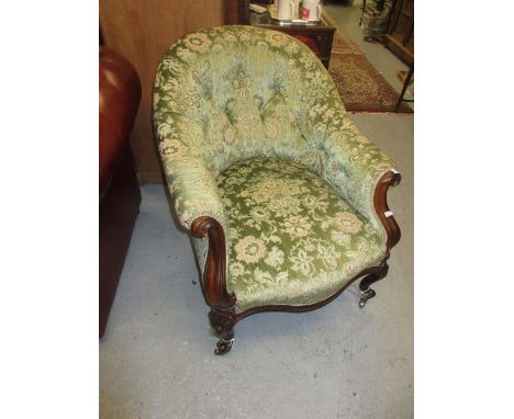 Victorian rosewood tub shaped button upholstered armchair with green floral upholstery raised on cabriole shell carved suppor