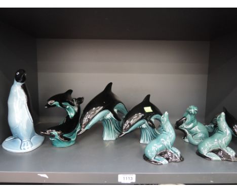 Eight Poole Pottery studies, Dolphins, Penguin & Otters